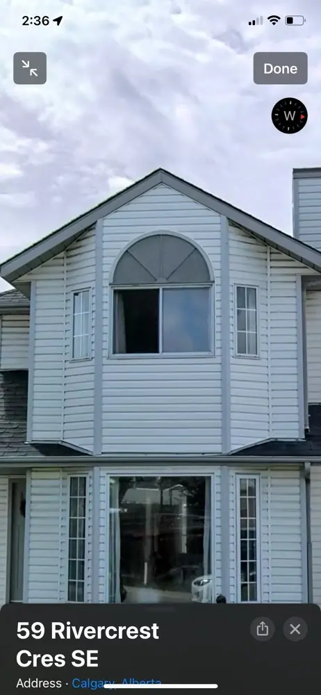 Siding installation at 59 Rivercrest Cres SE, Calgary
